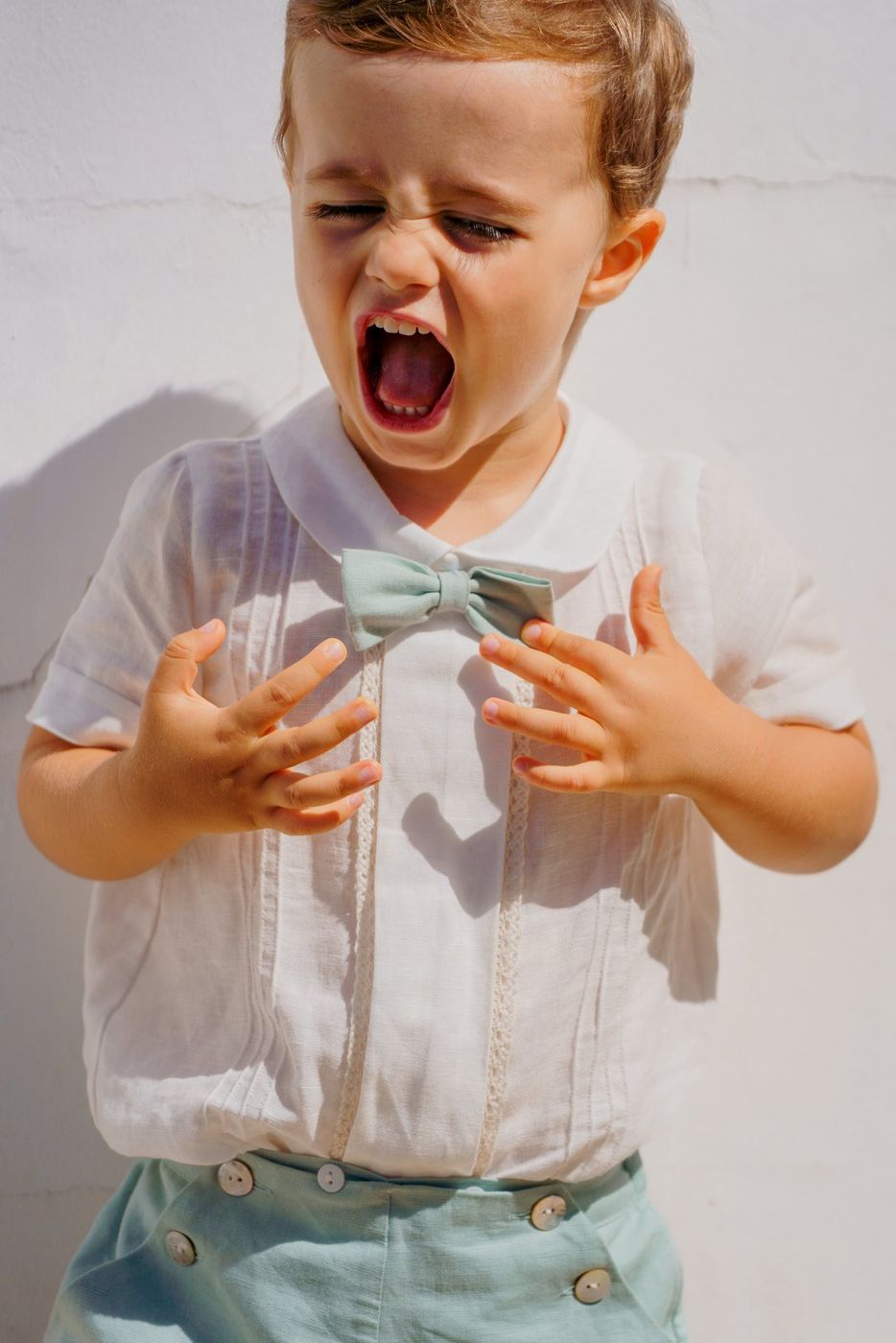 Little boy pulling a face