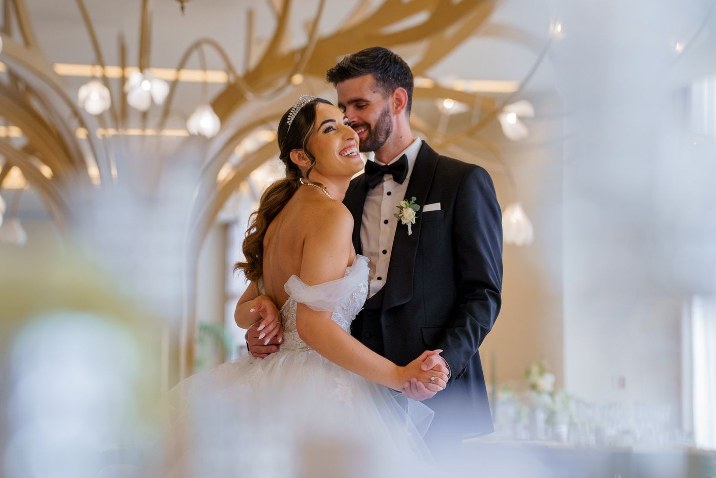 Bride and groom hugging and laughing
