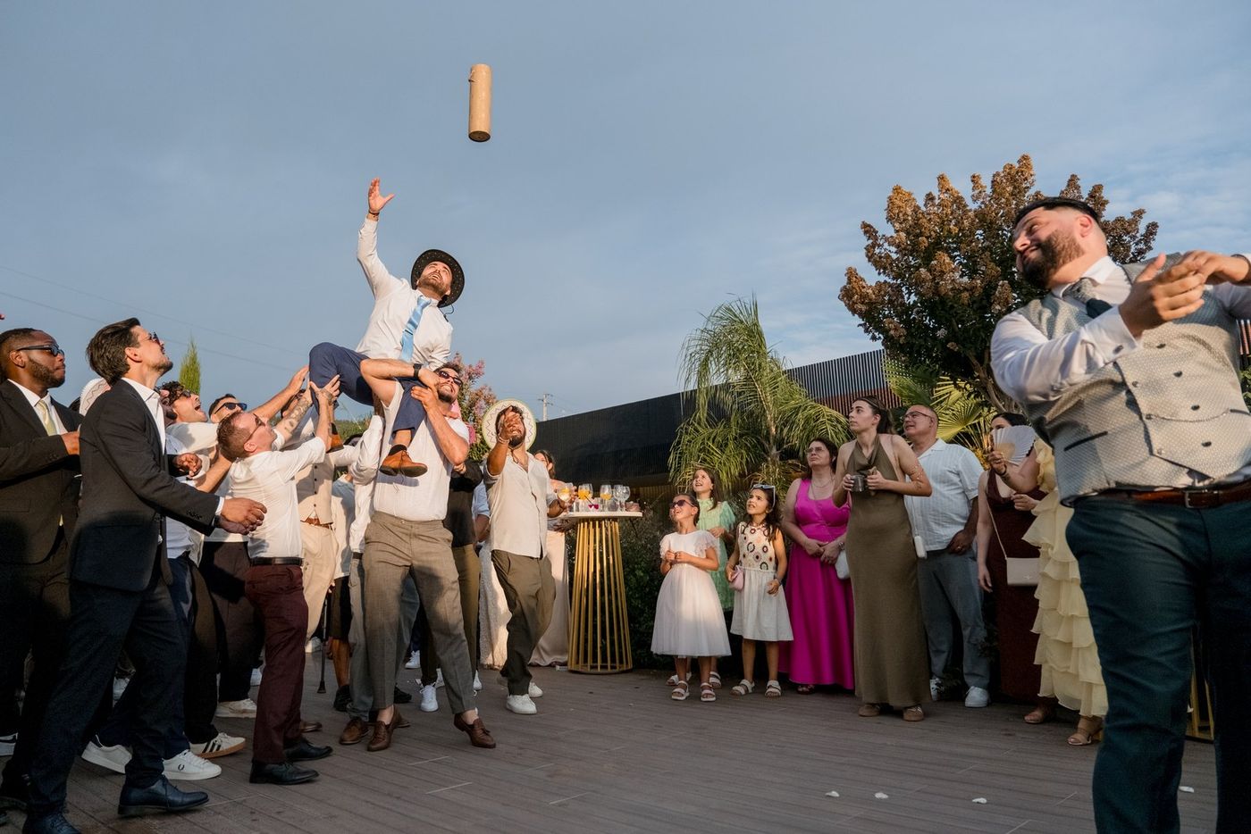Groom thrown in the air by his friends