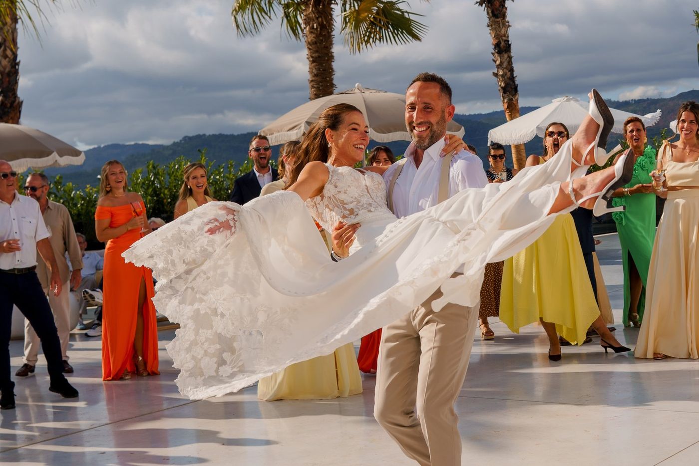 Groom lifting the bride on the dance floor