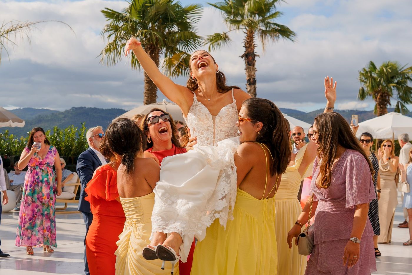 Bride lifted up by her friends