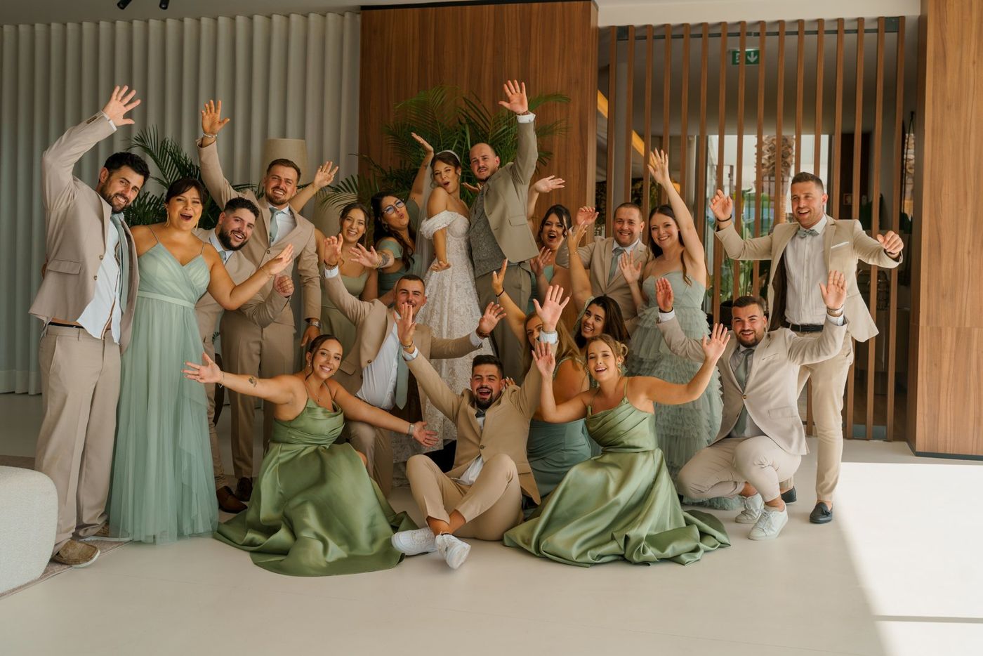 Friends jumping and cheering at the party