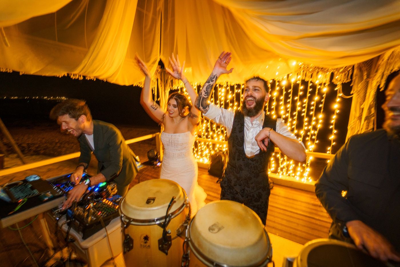 Bride dancing at the reception at night