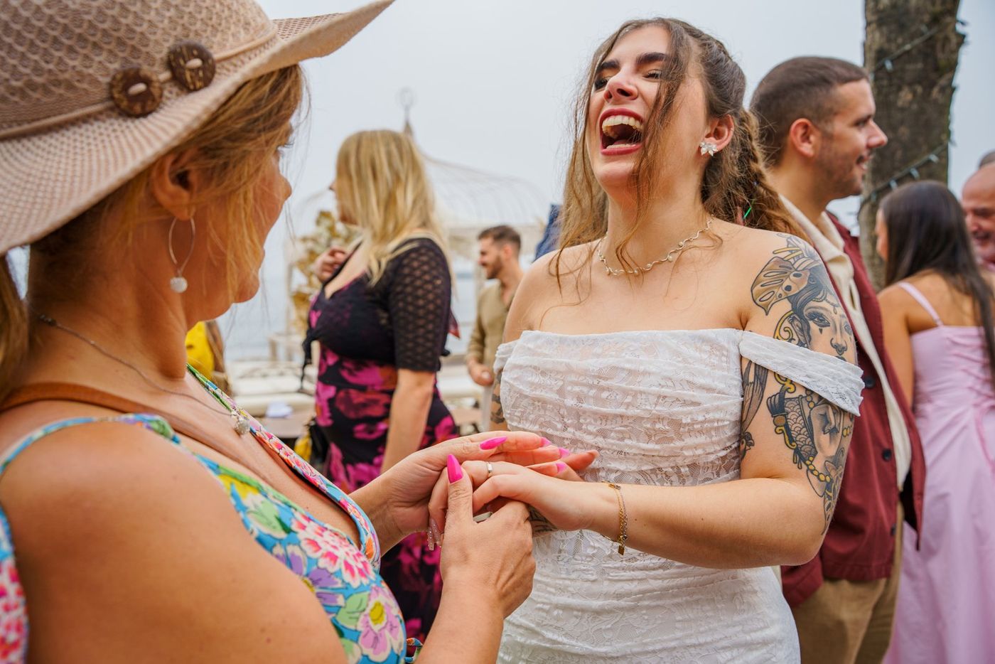 Bride showing her ring to a guest