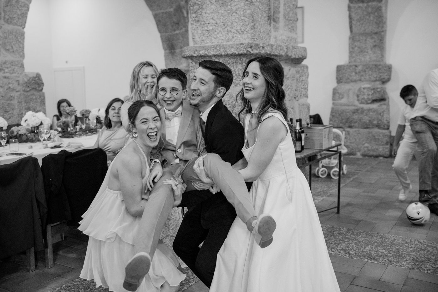 Friends lifting the boy up