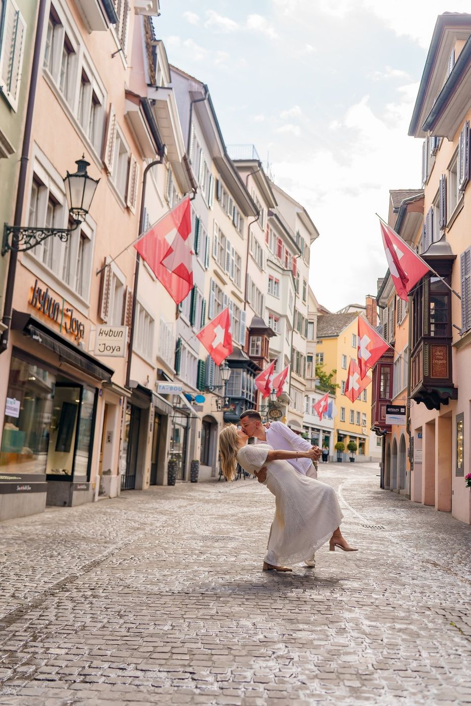 He dips her for a kiss on a Zurich street
