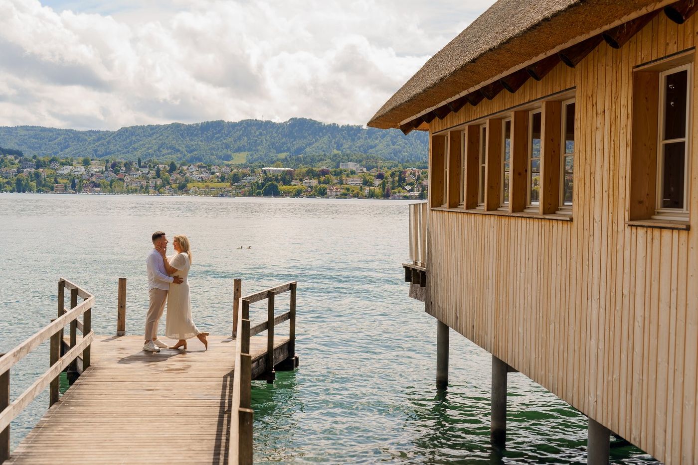 Couple on a jetty over the lake