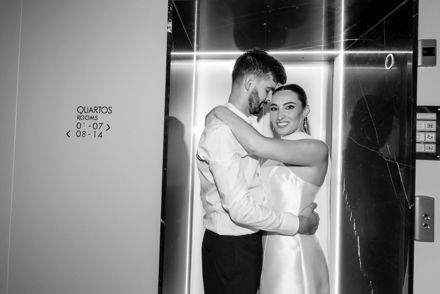 Couple in an elevator, in black and white