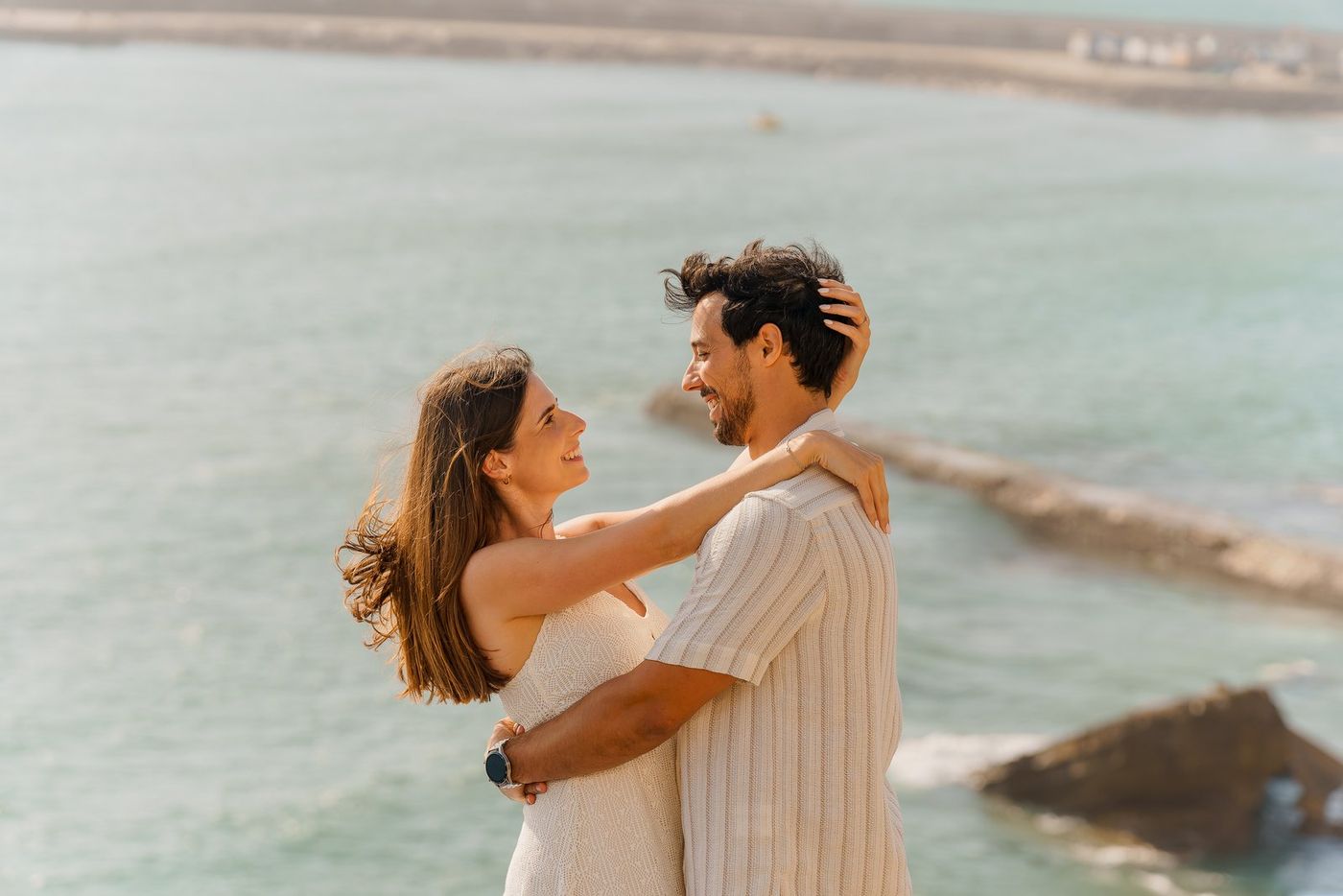 Couple embracing by the sea