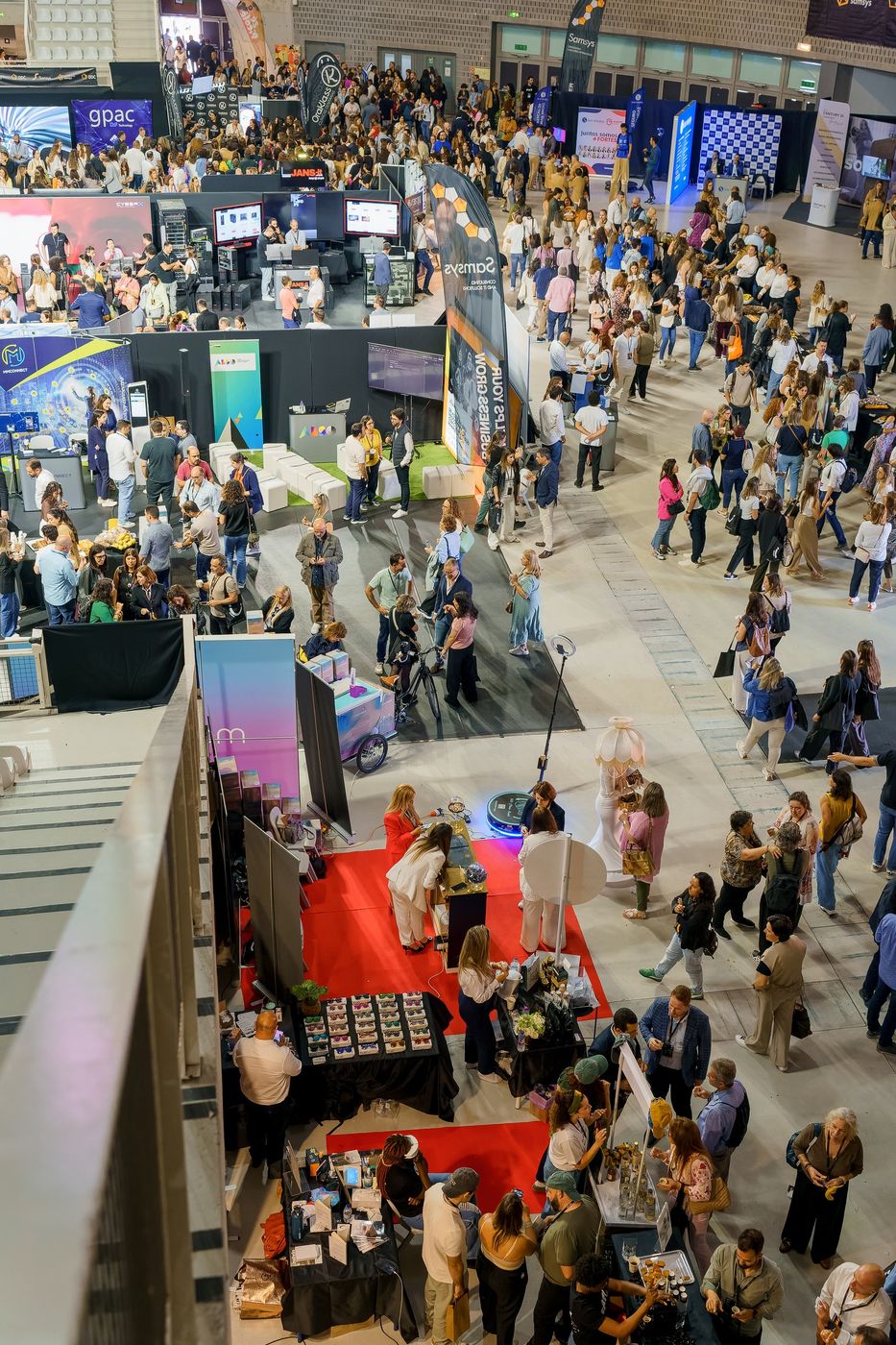 Trade fair with stands and crowds, seen from above