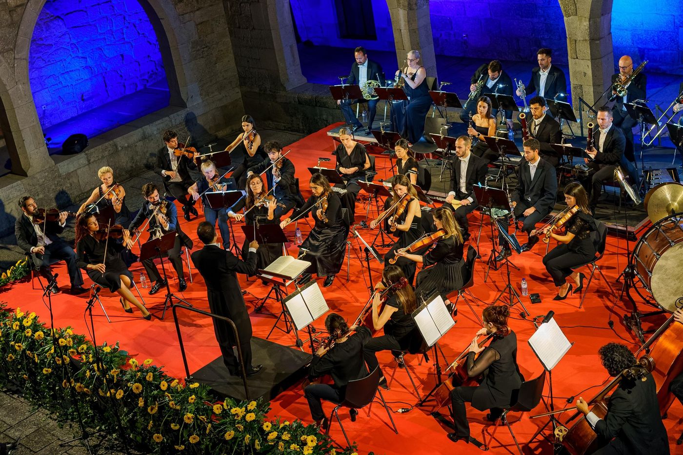 Orchestra at an open-air concert at night
