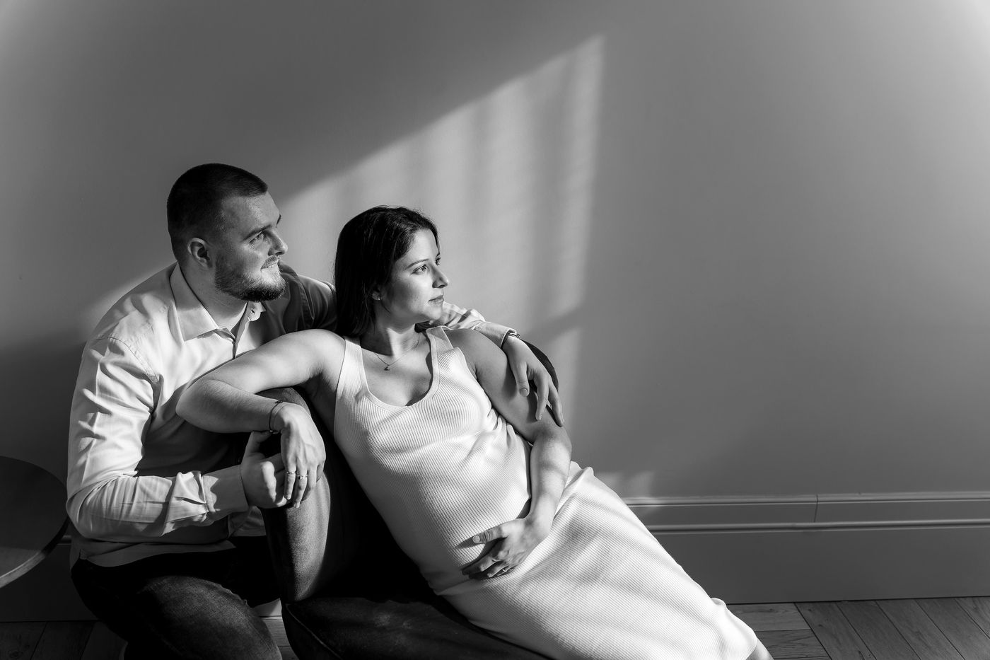 Expecting couple, in black and white